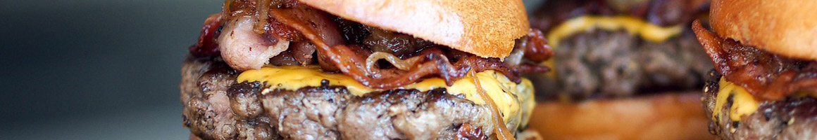 Eating Burger at Pino Burger restaurant in Laredo, TX.